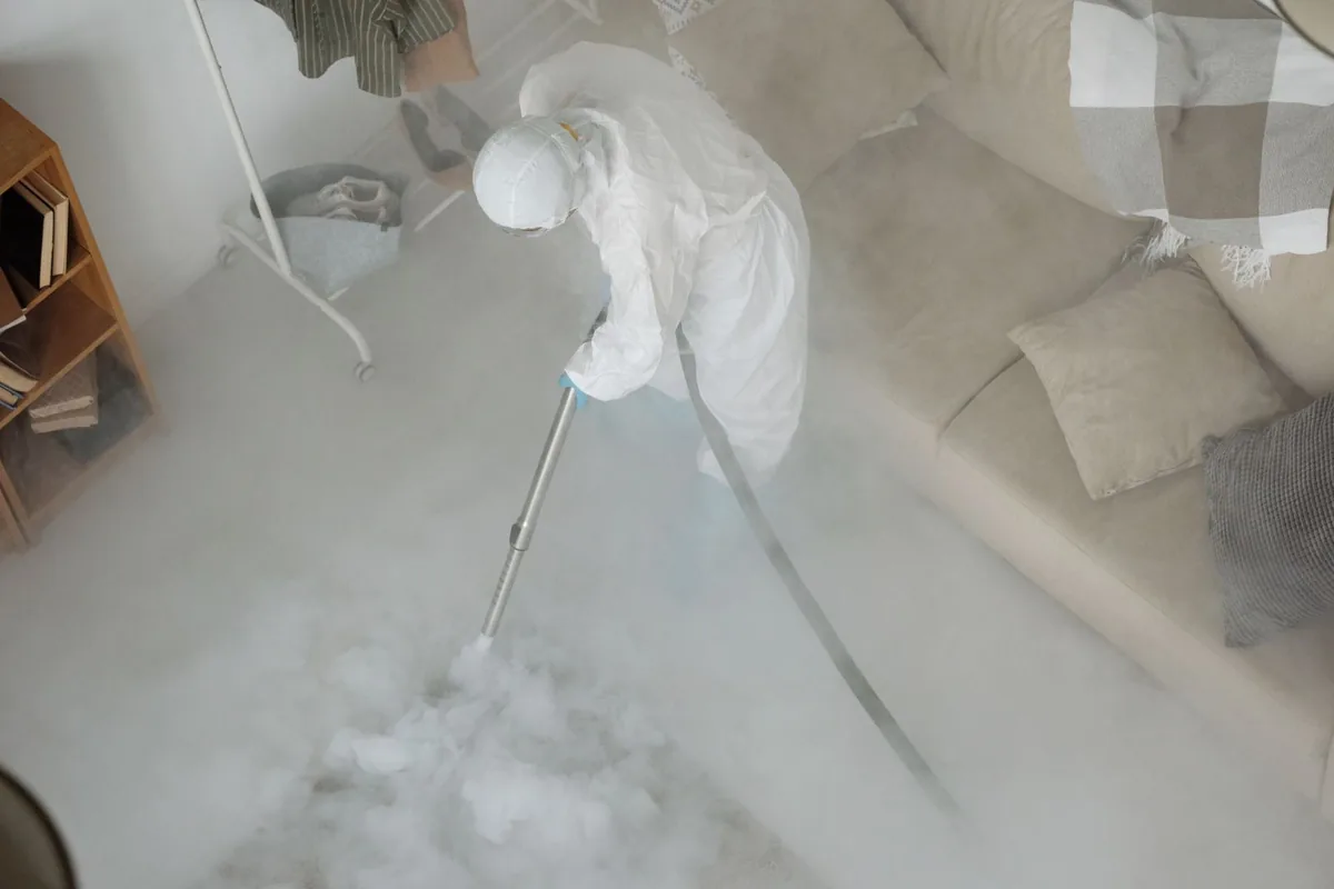 Biohazard cleanup technician in protective equipment, Massena, NY